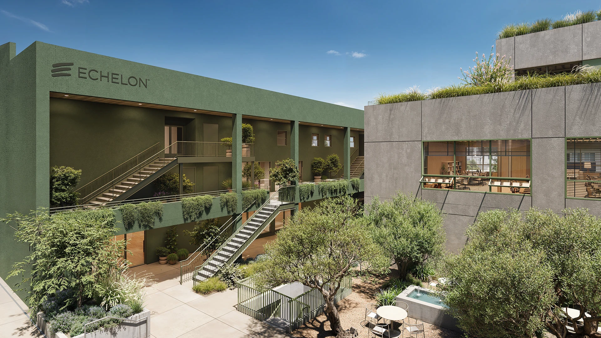 Vista de un moderno edificio con un patio central con vegetación y áreas de descanso.